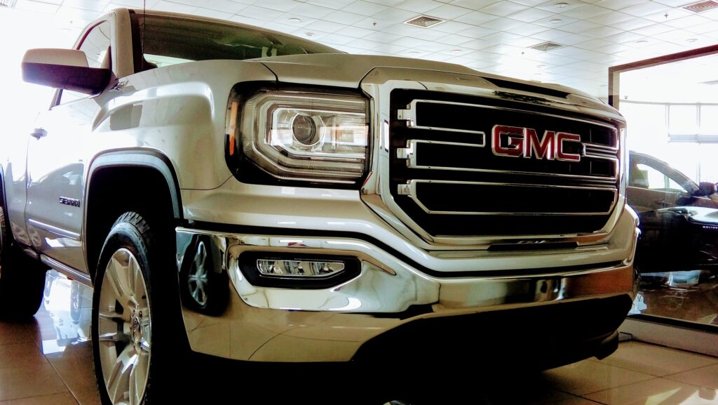 Pearl white GMC car, front view